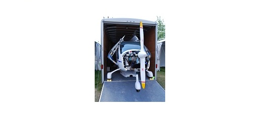 Small aircraft in an enclosed transport trailer